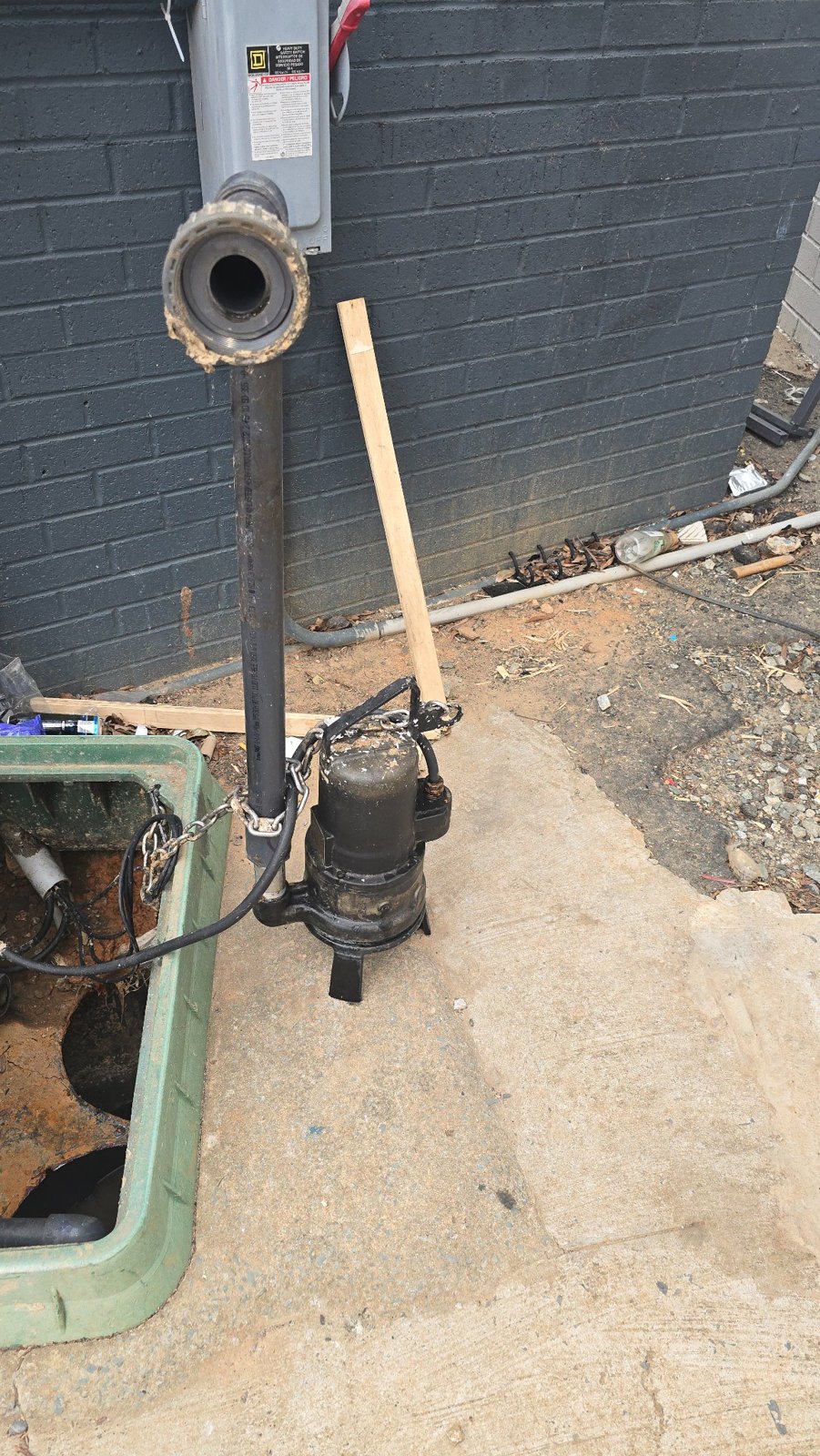 Sewage pump and attached discharge pipe removed from the basin during a RYN service visit