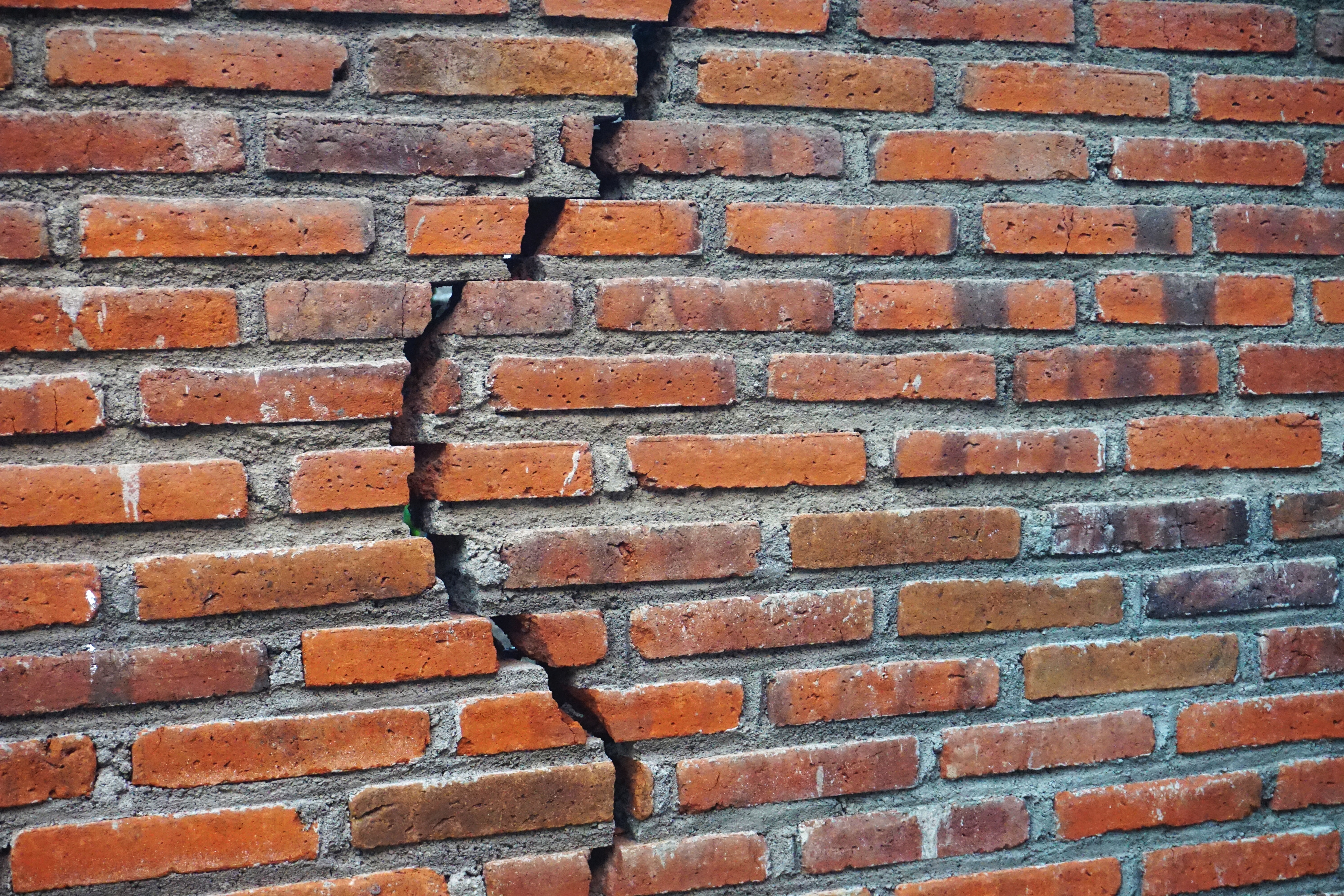 Brick wall with crack through it